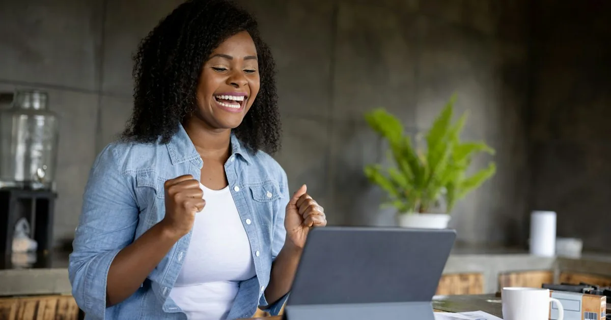 Small business owner reviewing grant and funding options on a laptop