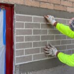 Worker Turns Plain Wall Into "Brick" Without Laying a Single Brick in New York, and Viewers Can't Decide if It's Genius or a Construction Catfish