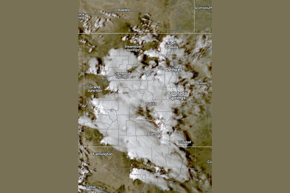 Satellite Shows Showers and Lightning Bubbling Over Colorado's Mountains as Clouds Blanket Much of the State